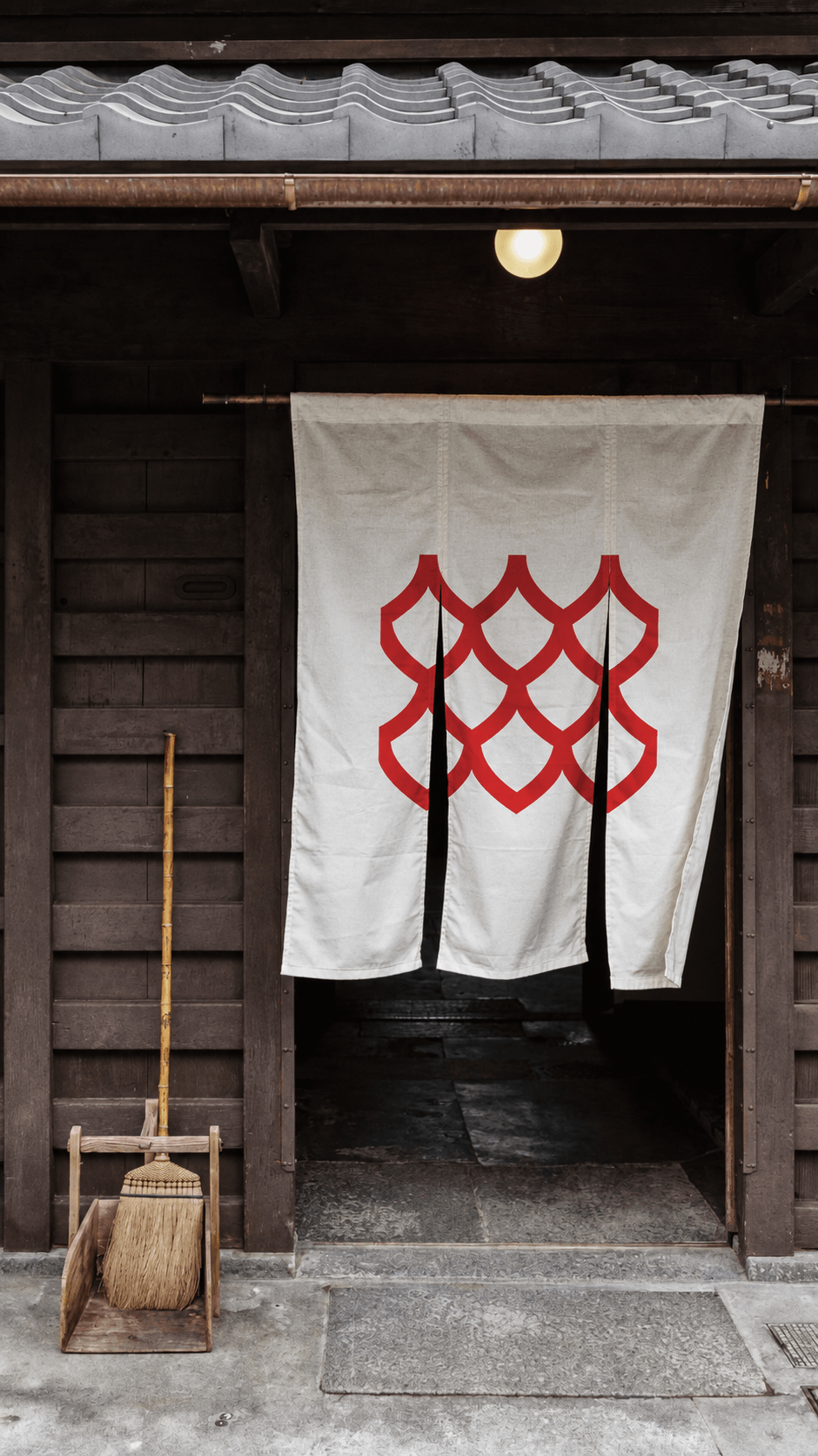 White banner with a red pattern hanging in a doorway